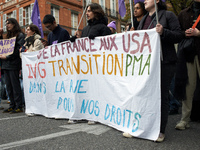 People hold a sheet reading 'From France to USA, Abortion, transition and ART, in the streets for our rights'. Women from the collective Nou...