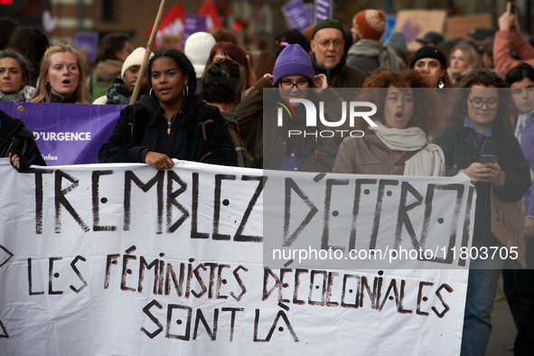 A group of women hold a sheet reading 'Tremble! The decolonial feminists are there'. Women from the collective NousToutes and other organiza...