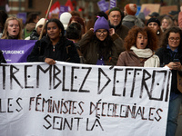 A group of women hold a sheet reading 'Tremble! The decolonial feminists are there'. Women from the collective NousToutes and other organiza...