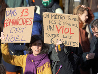 Two women hold placards reading 'in 13 feminicides it's Christmas' and 'A metro every 2 minutes, a rape every 6 minutes'. Women from the col...