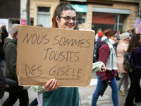 A woman holds a placard reading 'We are Gisele Pelicaud', a woman whose husband proposed to dozens of men while she was under the influence...