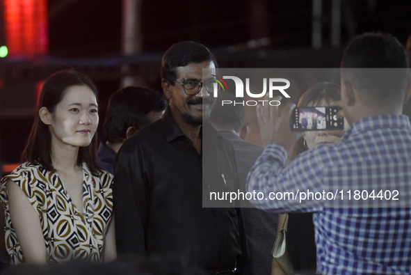 Janatha Vimukthi Peramuna (JVP) General Secretary Tilvin Silva smiles as they pose for a photograph at an ABBA tribute band Arrival from Swe...