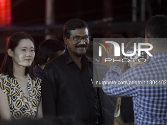 Janatha Vimukthi Peramuna (JVP) General Secretary Tilvin Silva smiles as they pose for a photograph at an ABBA tribute band Arrival from Swe...