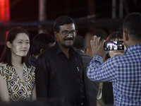 Janatha Vimukthi Peramuna (JVP) General Secretary Tilvin Silva smiles as they pose for a photograph at an ABBA tribute band Arrival from Swe...