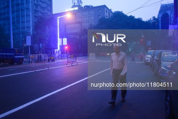 A person walks on a street on a winter morning in Kolkata, India, on November 24, 2024. 