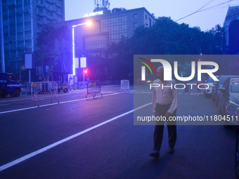 A person walks on a street on a winter morning in Kolkata, India, on November 24, 2024. (