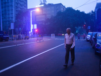 A person walks on a street on a winter morning in Kolkata, India, on November 24, 2024. (