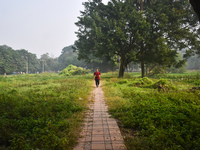 A person runs inside a park in Kolkata, India, on November 24, 2024, on a winter morning. (