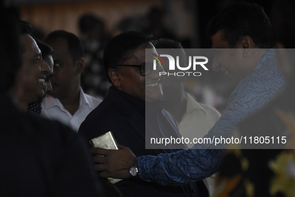 Foreign Minister Vijitha Herath (C) gestures as the ABBA tribute band arrives from Sweden for a live concert in Colombo, Sri Lanka, on Novem...