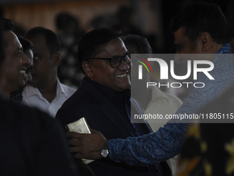 Foreign Minister Vijitha Herath (C) gestures as the ABBA tribute band arrives from Sweden for a live concert in Colombo, Sri Lanka, on Novem...