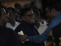 Foreign Minister Vijitha Herath (C) gestures as the ABBA tribute band arrives from Sweden for a live concert in Colombo, Sri Lanka, on Novem...