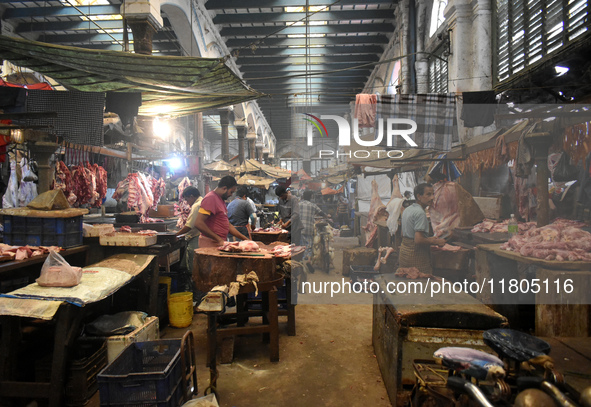 Vendors prepare red meats inside a wholesale market in Kolkata, India, on November 24, 2024. 