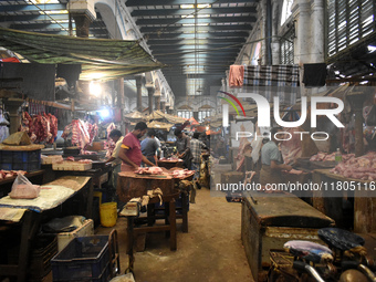 Vendors prepare red meats inside a wholesale market in Kolkata, India, on November 24, 2024. (