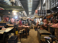 Vendors prepare red meats inside a wholesale market in Kolkata, India, on November 24, 2024. (