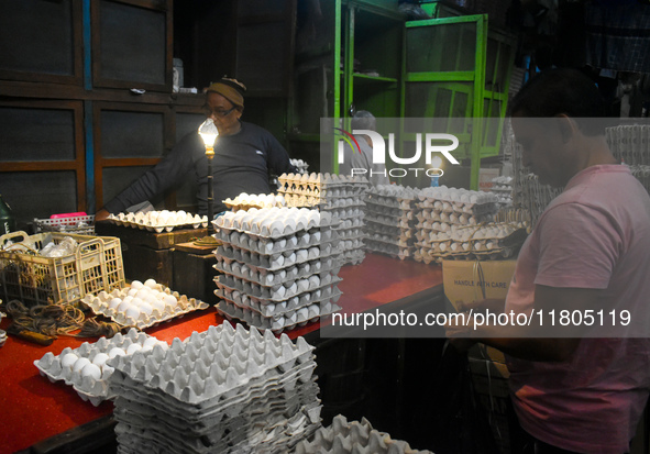 A person sells eggs inside a wholesale market in Kolkata, India, on November 24, 2024. 