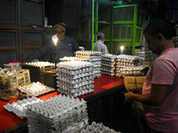 A person sells eggs inside a wholesale market in Kolkata, India, on November 24, 2024. (