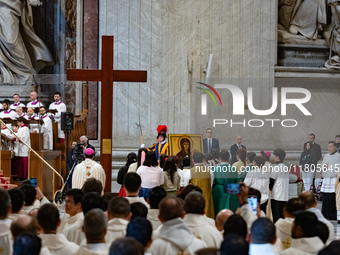 Youths hand over the cross of the World Youth Day to organizers of the next edition that will be held in Seoul, South Korea, in 2027, during...