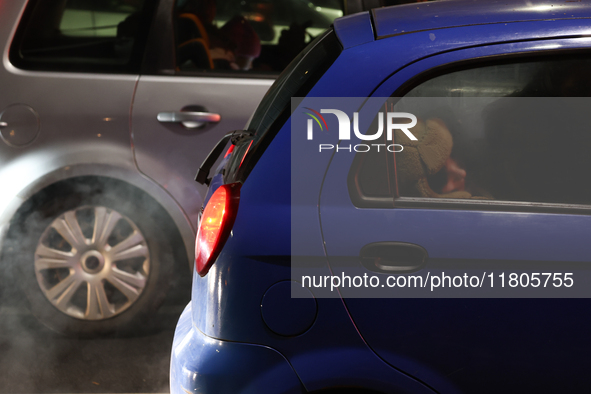 A person rests in a car in Torun, Poland on November 23, 2024. 