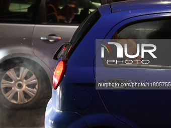 A person rests in a car in Torun, Poland on November 23, 2024. (