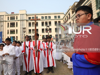 Catholics participate in the annual Corpus Christi procession in Kolkata, India, on November 24, 2024. (