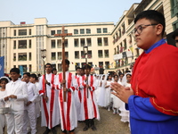 Catholics participate in the annual Corpus Christi procession in Kolkata, India, on November 24, 2024. (