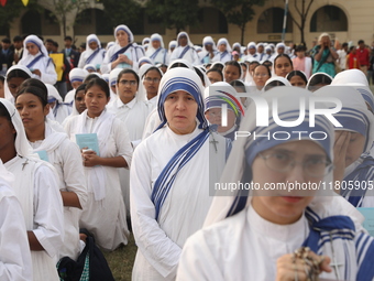 Catholic nuns from the Missionaries of Charity, the global order of nuns founded by Saint Mother Teresa, pray at a mass during the annual Co...