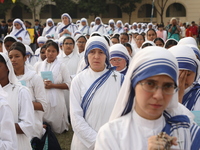 Catholic nuns from the Missionaries of Charity, the global order of nuns founded by Saint Mother Teresa, pray at a mass during the annual Co...