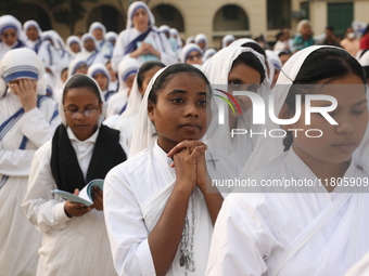 Catholic nuns from the Missionaries of Charity, the global order of nuns founded by Saint Mother Teresa, pray at a mass during the annual Co...