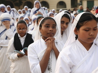 Catholic nuns from the Missionaries of Charity, the global order of nuns founded by Saint Mother Teresa, pray at a mass during the annual Co...