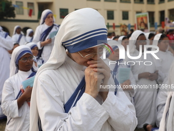 Catholic nuns from the Missionaries of Charity, the global order of nuns founded by Saint Mother Teresa, pray at a mass during the annual Co...