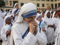 Catholic nuns from the Missionaries of Charity, the global order of nuns founded by Saint Mother Teresa, pray at a mass during the annual Co...