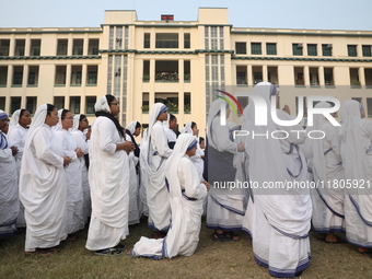 Catholic nuns from the Missionaries of Charity, the global order of nuns founded by Saint Mother Teresa, pray at a mass during the annual Co...