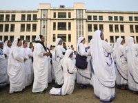 Catholic nuns from the Missionaries of Charity, the global order of nuns founded by Saint Mother Teresa, pray at a mass during the annual Co...