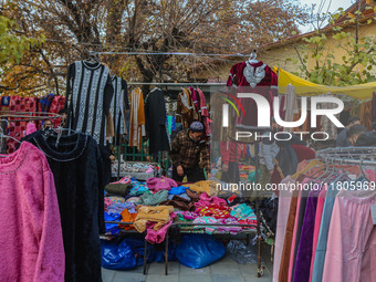 People buy warm clothes at a Sunday Market in Srinagar, Jammu and Kashmir, on November 24, 2024. (