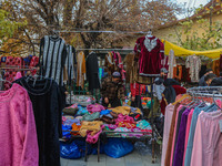 People buy warm clothes at a Sunday Market in Srinagar, Jammu and Kashmir, on November 24, 2024. (