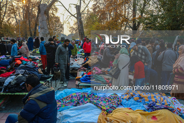 People buy warm clothes at a Sunday Market in Srinagar, Jammu and Kashmir, on November 24, 2024. 