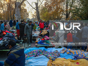 People buy warm clothes at a Sunday Market in Srinagar, Jammu and Kashmir, on November 24, 2024. (