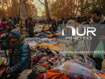 People buy warm clothes at a Sunday Market in Srinagar, Jammu and Kashmir, on November 24, 2024. (