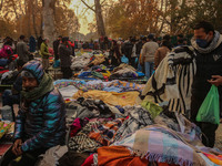 People buy warm clothes at a Sunday Market in Srinagar, Jammu and Kashmir, on November 24, 2024. (