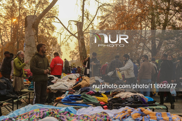 People buy warm clothes at a Sunday Market in Srinagar, Jammu and Kashmir, on November 24, 2024. 