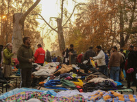 People buy warm clothes at a Sunday Market in Srinagar, Jammu and Kashmir, on November 24, 2024. (