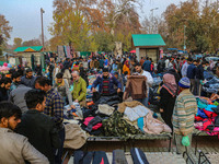 People buy warm clothes at a Sunday Market in Srinagar, Jammu and Kashmir, on November 24, 2024. (