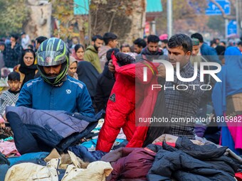 People buy warm clothes at a Sunday Market in Srinagar, Jammu and Kashmir, on November 24, 2024. (