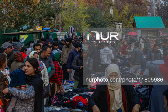 People buy warm clothes at a Sunday Market in Srinagar, Jammu and Kashmir, on November 24, 2024. 