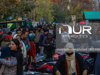 People buy warm clothes at a Sunday Market in Srinagar, Jammu and Kashmir, on November 24, 2024. (