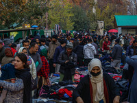 People buy warm clothes at a Sunday Market in Srinagar, Jammu and Kashmir, on November 24, 2024. (