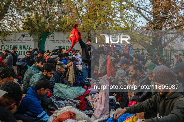 People buy warm clothes at a Sunday Market in Srinagar, Jammu and Kashmir, on November 24, 2024. 