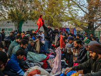 People buy warm clothes at a Sunday Market in Srinagar, Jammu and Kashmir, on November 24, 2024. (