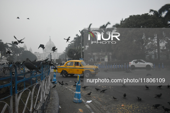 A yellow taxi moves on the road on a smoggy morning due to air pollution in Kolkata, India, on November 24, 2024. 