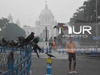 A person walks on the street on a smoggy morning due to air pollution in Kolkata, India, on November 24, 2024. (